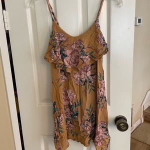 Girl’s yellow summer dress with floral design